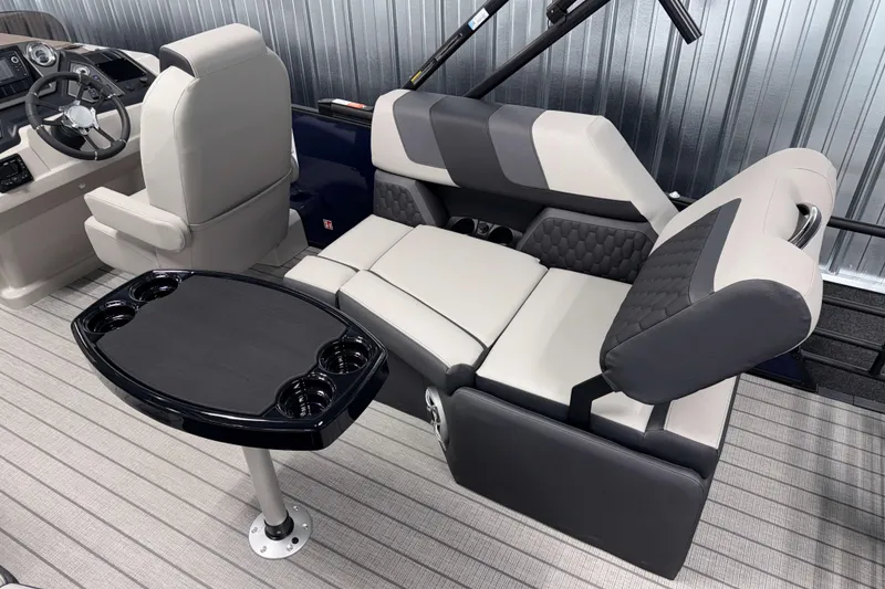 Slide: The Image of 2026 Sylvan L1 LZ boat interior with plush seating and a sleek table. - 4
