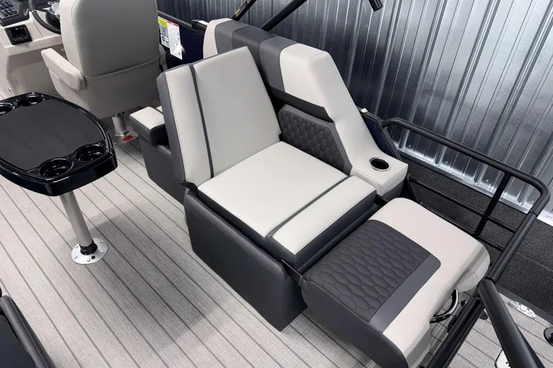Slide: The Image of Luxurious seating in 2026 Sylvan L1 LZ boat with modern design and cup holders. - 5