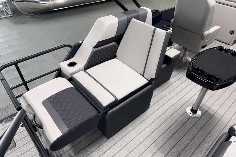 Slide: The Image of Luxurious seating on 2026 Sylvan L1 LZ boat with modern design and cup holders. - 7
