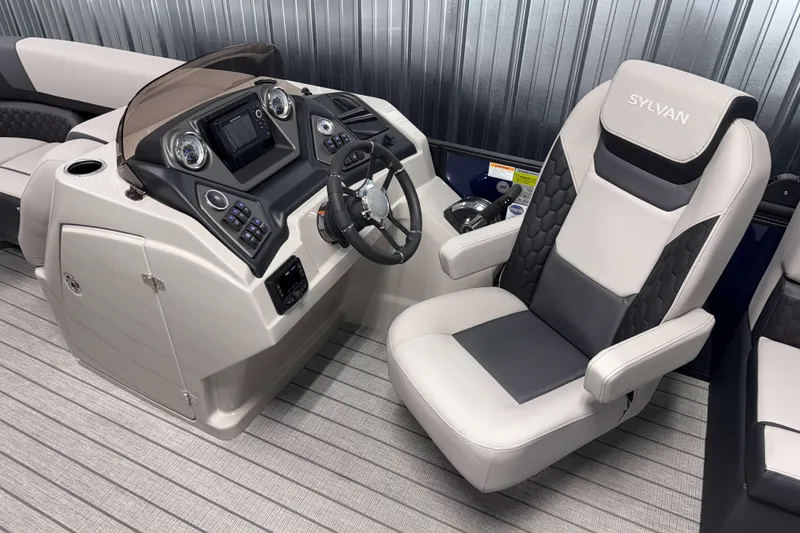 Slide: The Image of 2026 Sylvan L1 LZ boat interior with modern helm and comfortable captain's chair. - 8