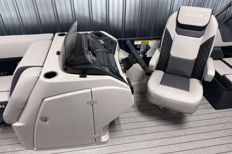 Slide: The Image of 2026 Sylvan L1 LZ boat interior with captain's chair and control console. - 9