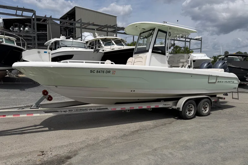 The Image of 2021 Sea Hunt Escape 27 boat on trailer, parked in marina lot. - 0
