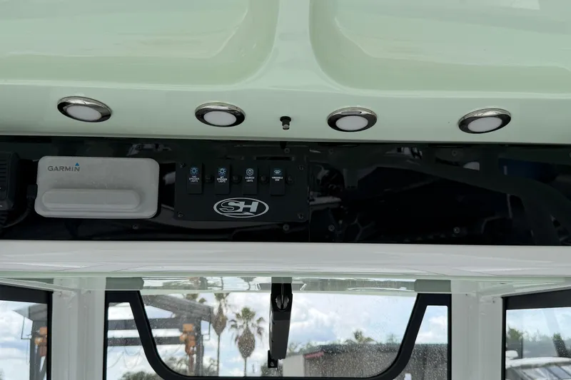 Slide: The Image of Control panel of 2021 Sea Hunt Escape 27 boat with Garmin device and lighting. - 2