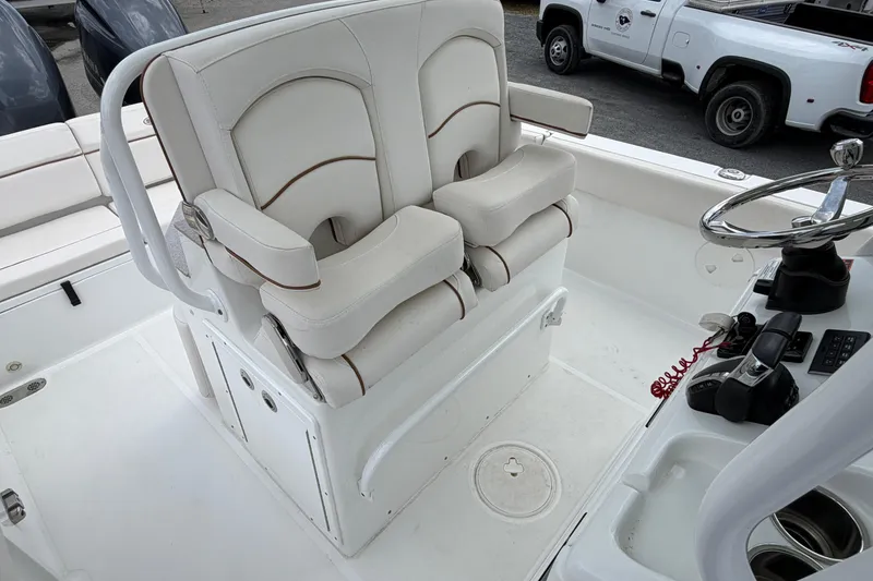 Slide: The Image of Captain's chairs and helm on 2021 Sea Hunt Escape 27 boat. - 6