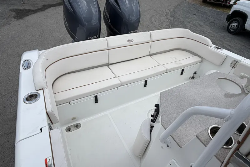 Slide: The Image of 2021 Sea Hunt Escape 27 boat interior with seating and dual Yamaha 200 engines. - 7