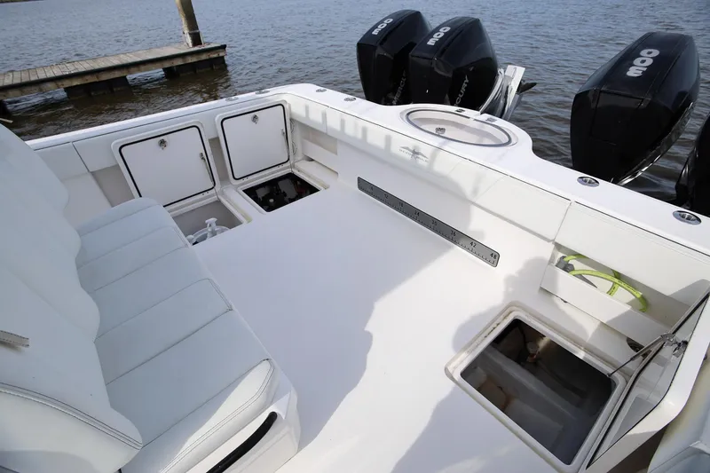 Slide: The Image of 2020 Invincible 35 Catamaran deck with seating and storage compartments. - 13