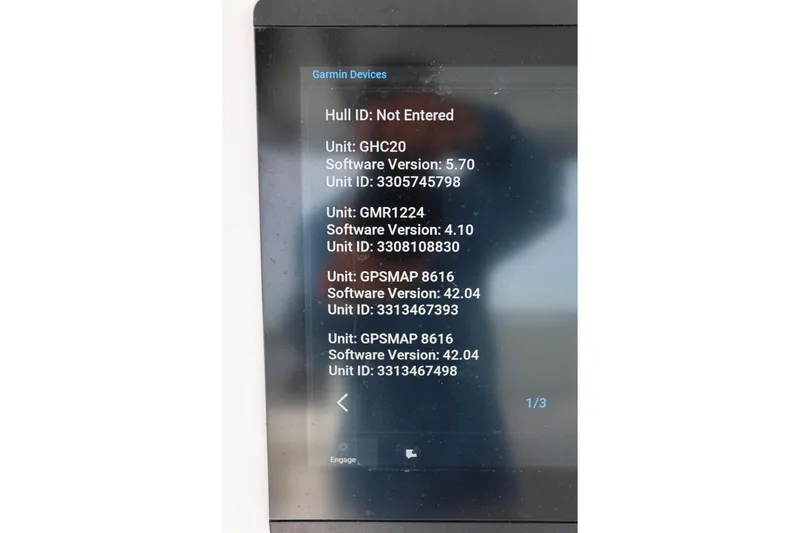Slide: The Image of Garmin device display on 2020 Invincible 35 Catamaran showing software versions and unit IDs. - 23