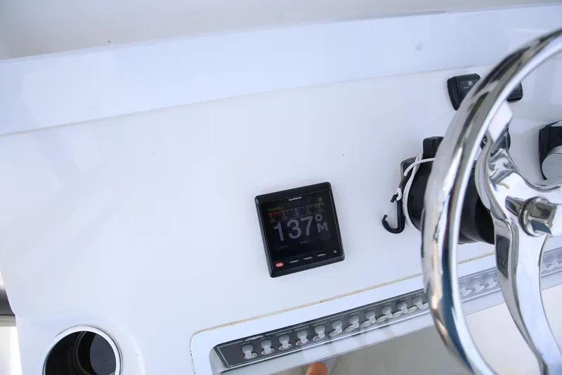 Slide: The Image of Helm of 2020 Invincible 35 Catamaran with Garmin display and steering wheel. - 25