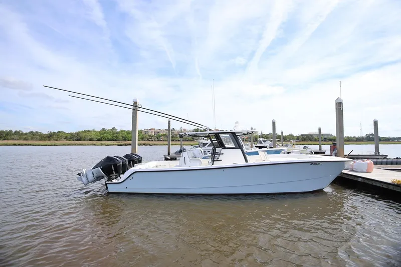 Slide: The Image of 2020 Invincible 35 Catamaran docked at marina under clear sky. - 3