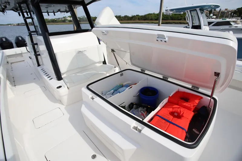 Slide: The Image of 2020 Invincible 35 Catamaran storage compartment with life jackets and gear. - 30