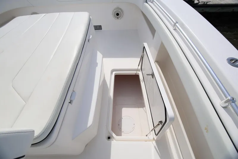 Slide: The Image of 2020 Invincible 35 Catamaran interior storage compartment with open hatch. - 34