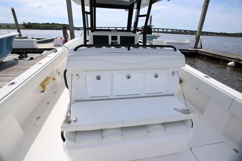 Slide: The Image of 2020 Invincible 35 Catamaran at dock, featuring spacious deck and storage compartments. - 40