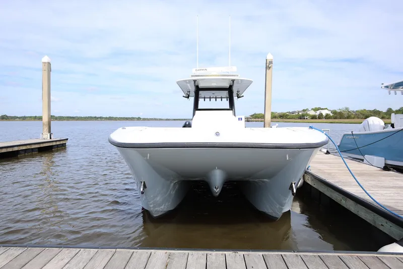 Slide: The Image of 2020 Invincible 35 Catamaran docked at marina, front view. - 5