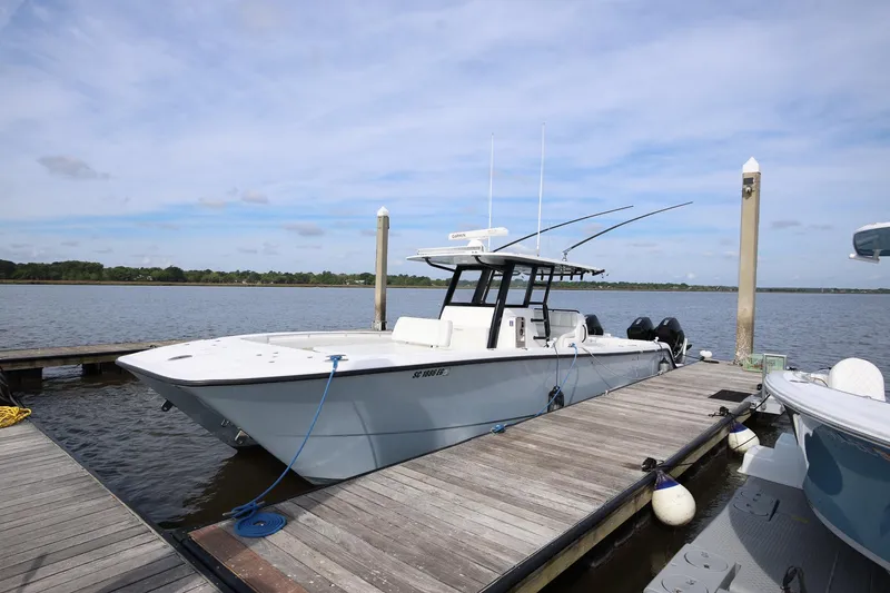 Slide: The Image of 2020 Invincible 35 Catamaran docked at a marina on a sunny day. - 6