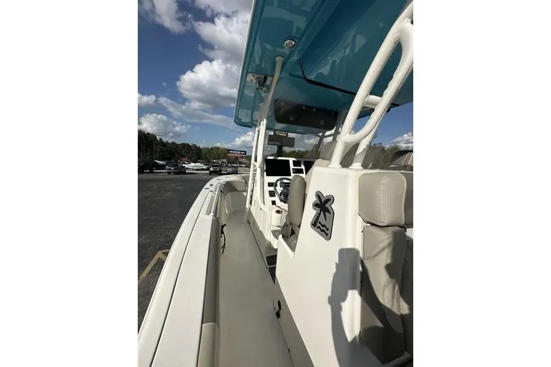 Slide: The Image of 2024 Key West 291 FS boat seating area with cushioned seats and elegant design. - 13