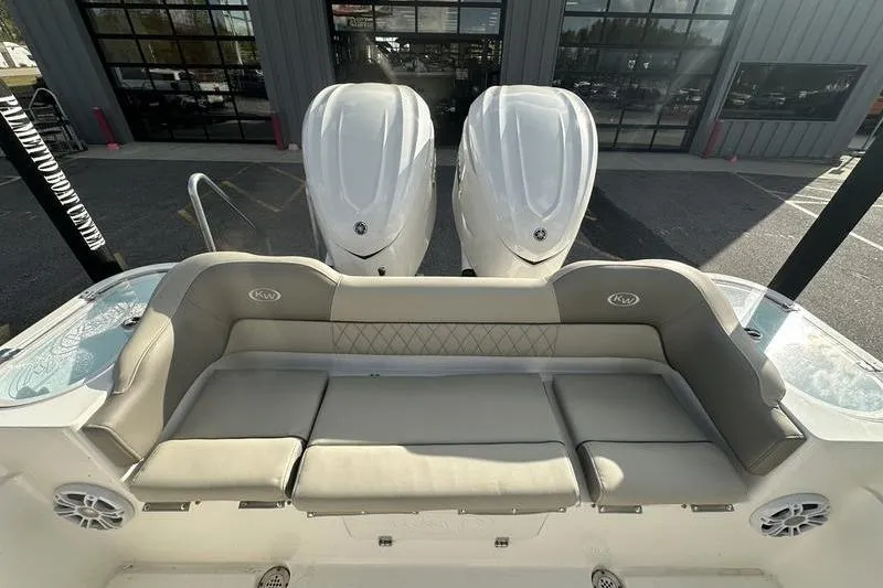 Slide: The Image of 2024 Key West 291 FS boat interior with plush seating and modern helm controls. - 15