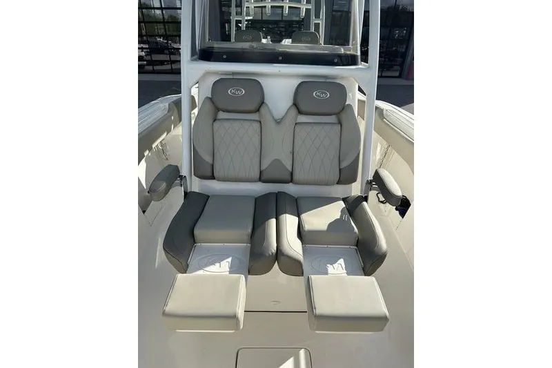 Slide: The Image of 2024 Key West 291 FS boat interior with cushioned seating and modern design. - 18