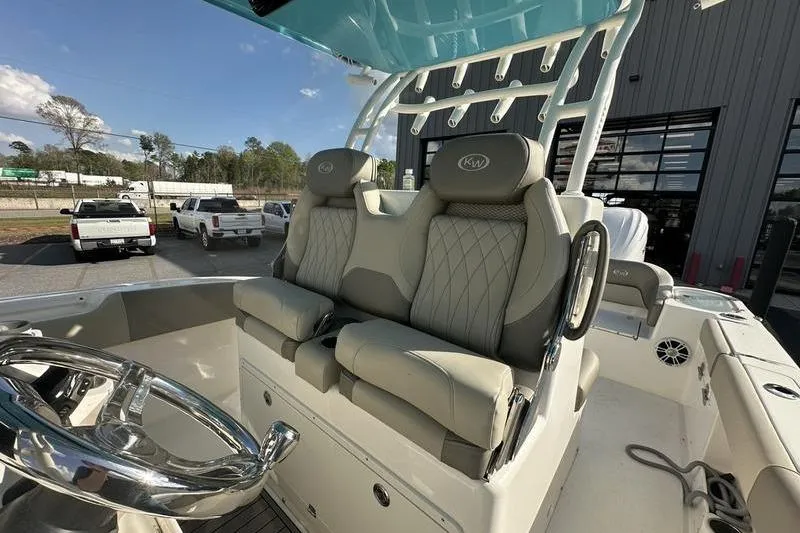 Slide: The Image of 2024 Key West 291 FS boat with dual engines and spacious seating. - 8