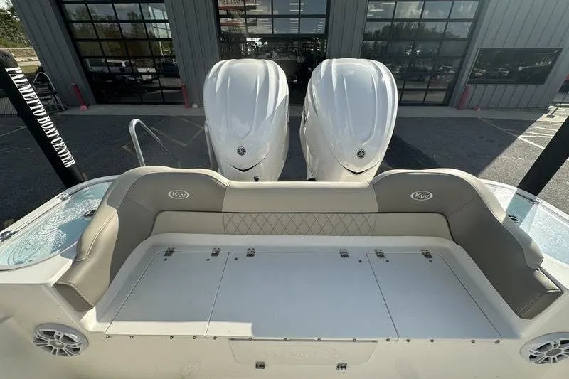 Slide: The Image of 2024 Key West 291 FS boat with twin Yamaha 350 V8 engines, parked outdoors. - 9