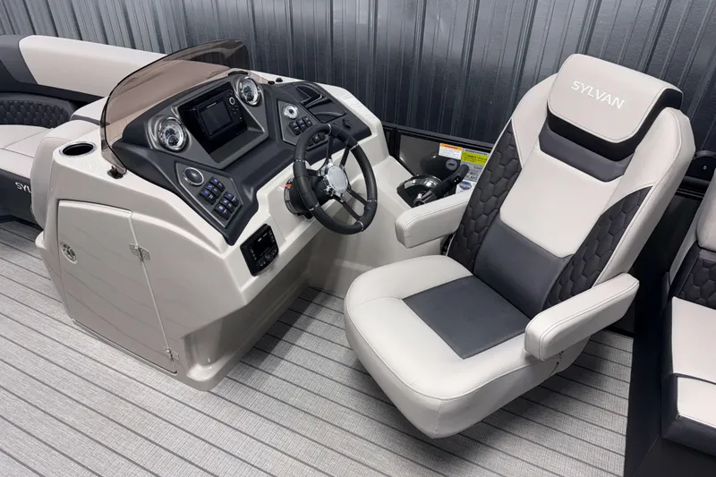 Slide: The Image of 2026 Sylvan L1 LZ boat interior with modern helm and comfortable captain's chair. - 10