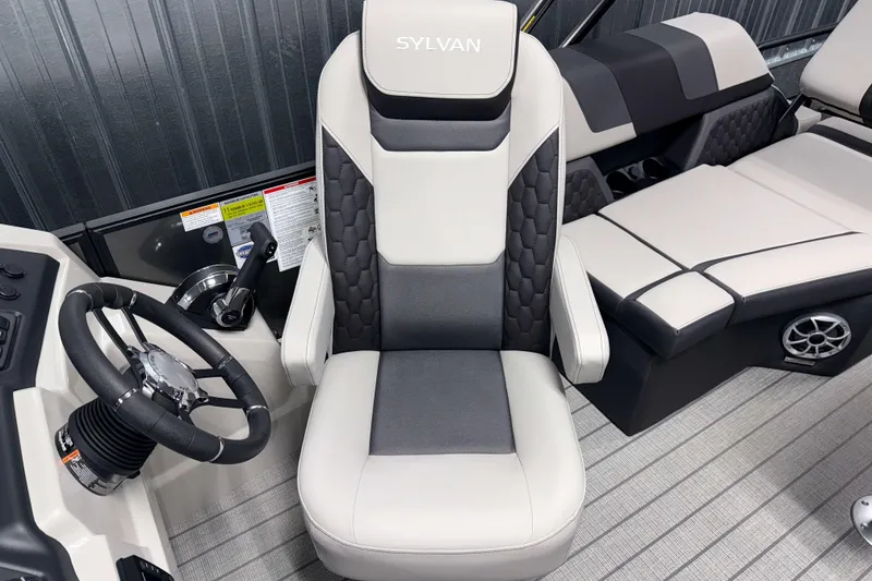 Slide: The Image of Captain's chair and controls of 2026 Sylvan L1 LZ boat interior. - 12