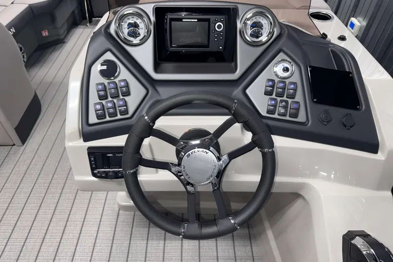 Slide: The Image of Steering console of 2026 Sylvan L1 LZ boat with modern controls and dashboard. - 13