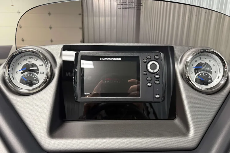 Slide: The Image of Dashboard of 2026 Sylvan L1 LZ with Humminbird Helix 5 display and gauges. - 14