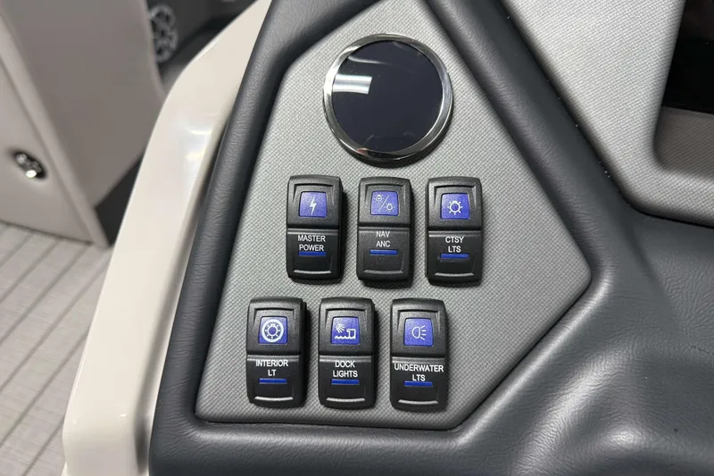 Slide: The Image of Control panel of 2026 Sylvan L1 LZ boat with various light switches. - 16