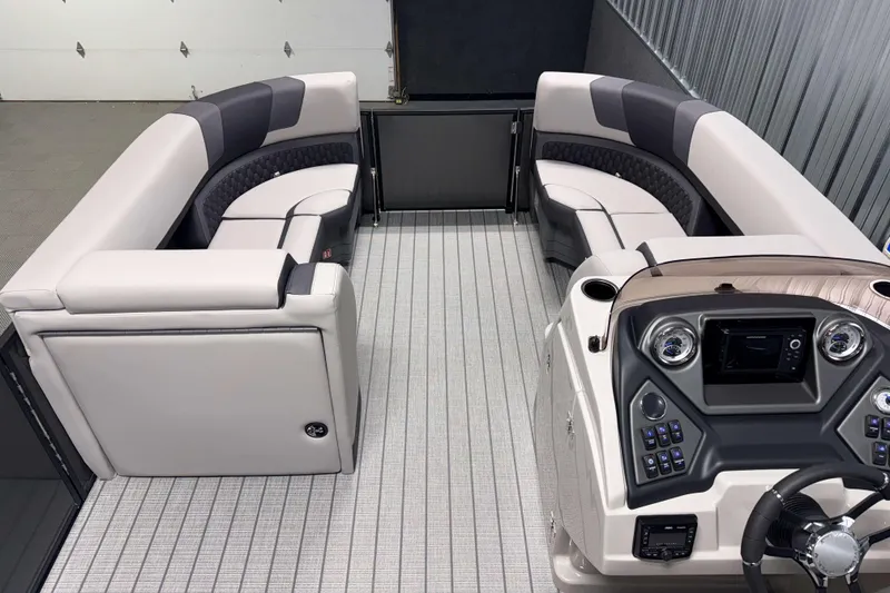 Slide: The Image of Interior of 2026 Sylvan L1 LZ pontoon boat with modern seating and control panel. - 19