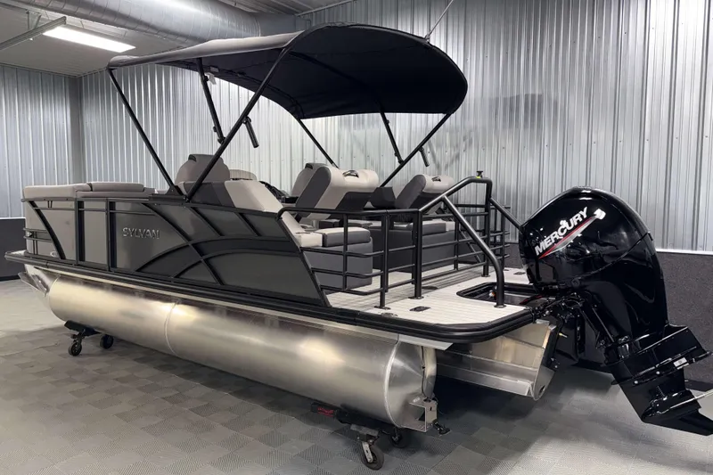 Slide: The Image of 2026 Sylvan L1 LZ pontoon boat with Mercury outboard motor in a showroom. - 30