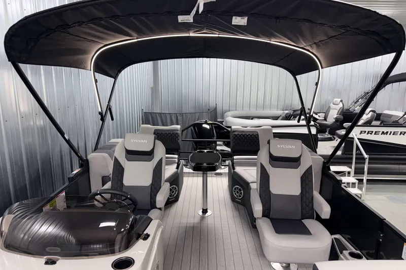Slide: The Image of 2026 Sylvan L1 LZ pontoon boat interior with canopy and modern seating. - 33
