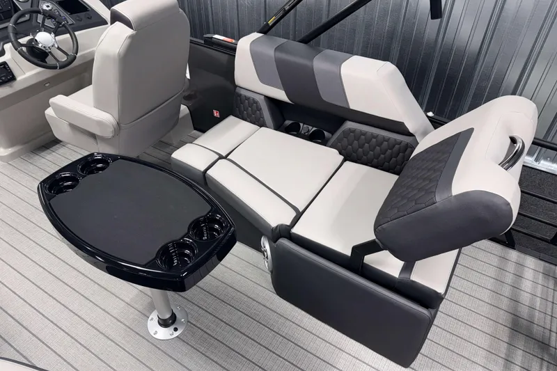 Slide: The Image of Luxurious interior of 2026 Sylvan L1 LZ boat with plush seating and sleek table design. - 4