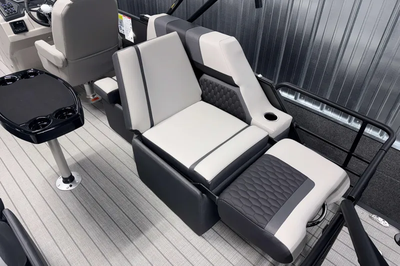 Slide: The Image of Luxurious seating on 2026 Sylvan L1 LZ boat with modern design and cup holders. - 6