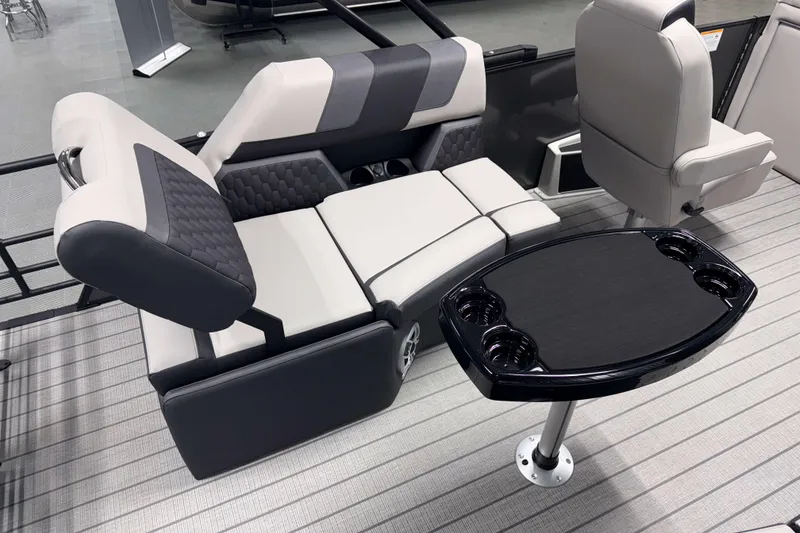 Slide: The Image of Luxurious seating and table setup on 2026 Sylvan L1 LZ boat, featuring modern design and comfort. - 7