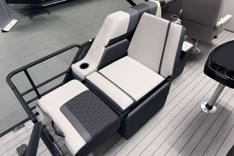 Slide: The Image of Luxurious seating on 2026 Sylvan L1 LZ boat, featuring modern design and integrated cup holder. - 9