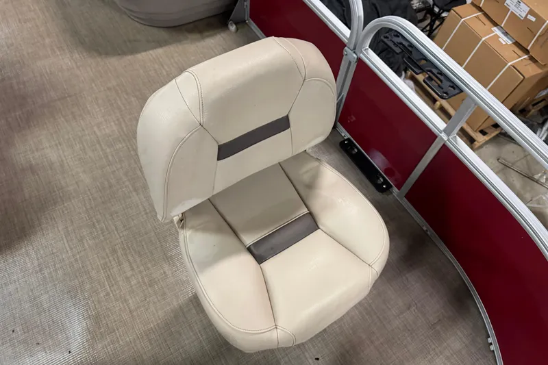 Slide: The Image of 2024 Sun Tracker Bass Buggy 16 XL Select boat seat, beige with gray accents, on deck. - 4