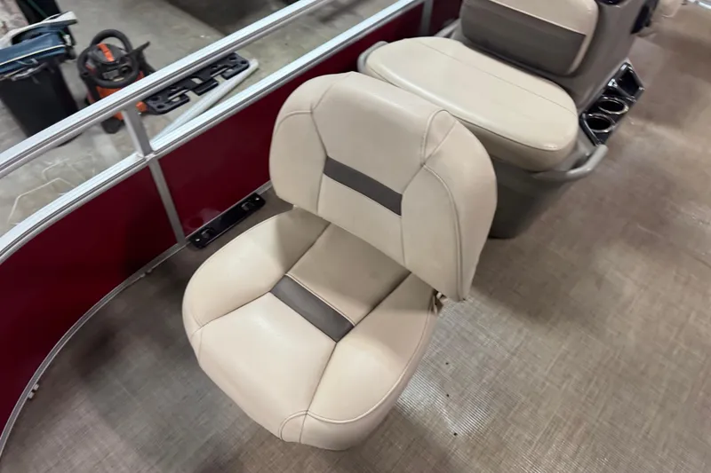 Slide: The Image of 2024 Sun Tracker Bass Buggy 16 XL Select boat seats, featuring beige upholstery and cup holders. - 5