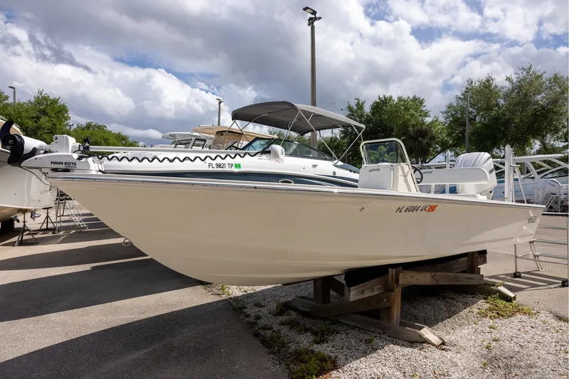 The Image of 2025 Hewes Redfisher 21 boat on display, featuring Minn Kota trolling motor. - 1
