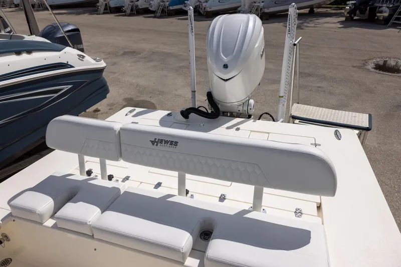 Slide: The Image of 2025 Hewes Redfisher 21 boat with white seating and Yamaha outboard motor. - 5