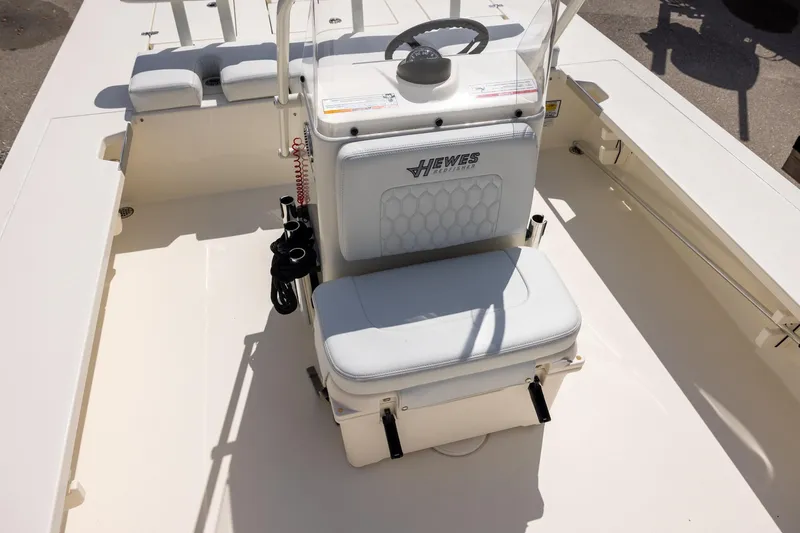 Slide: The Image of 2025 Hewes Redfisher 21 boat interior with steering console and seating. - 9