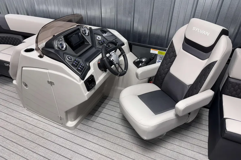 Slide: The Image of 2026 Sylvan L1 LZ boat interior with modern helm and comfortable captain's chair. - 10