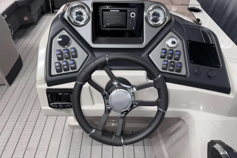 Slide: The Image of 2026 Sylvan L1 LZ boat dashboard with steering wheel and control panel. - 13