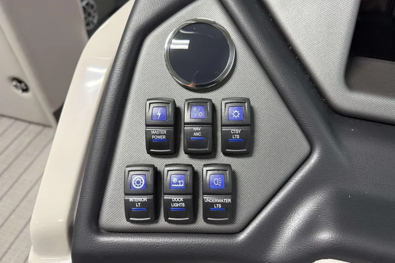 Slide: The Image of Control panel of 2026 Sylvan L1 LZ boat with various light switches. - 16