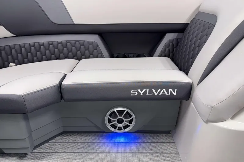 Slide: The Image of 2026 Sylvan L1 LZ boat interior with stylish seating and integrated speaker system. - 22