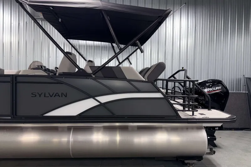 Slide: The Image of 2026 Sylvan L1 LZ pontoon boat with Mercury engine in a showroom. - 28