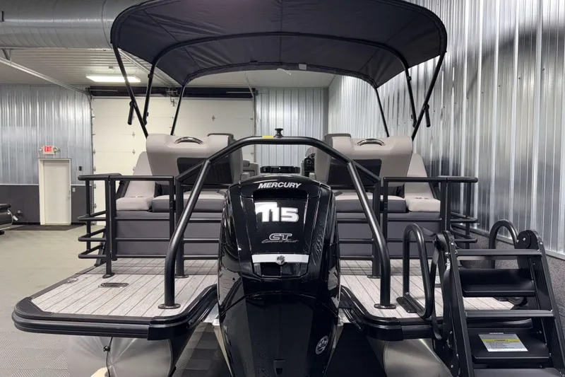 Slide: The Image of 2026 Sylvan L1 LZ pontoon boat with Mercury 115 engine in a showroom. - 30