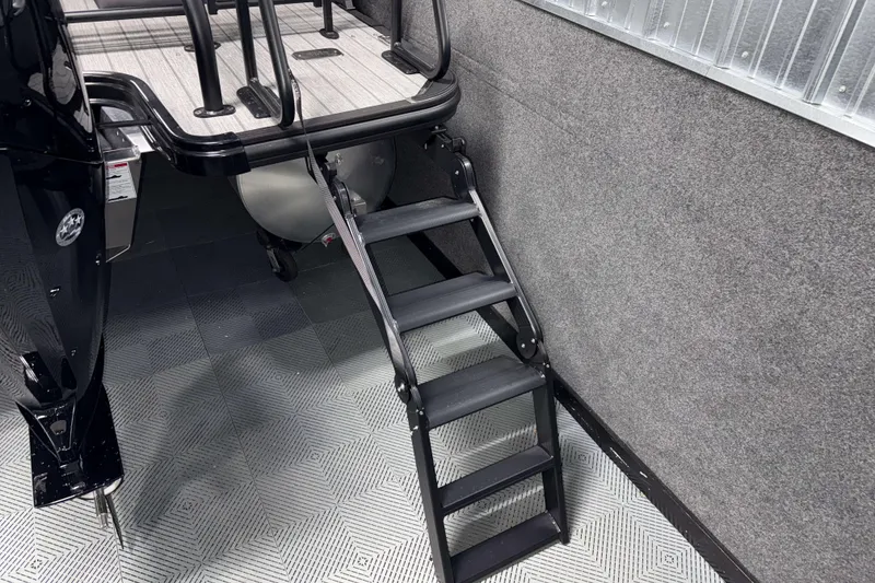 Slide: The Image of 2026 Sylvan L1 LZ boat with foldable boarding ladder and textured flooring. - 31
