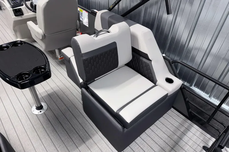 Slide: The Image of 2026 Sylvan L1 LZ boat interior with gray seating and cup holders. - 5