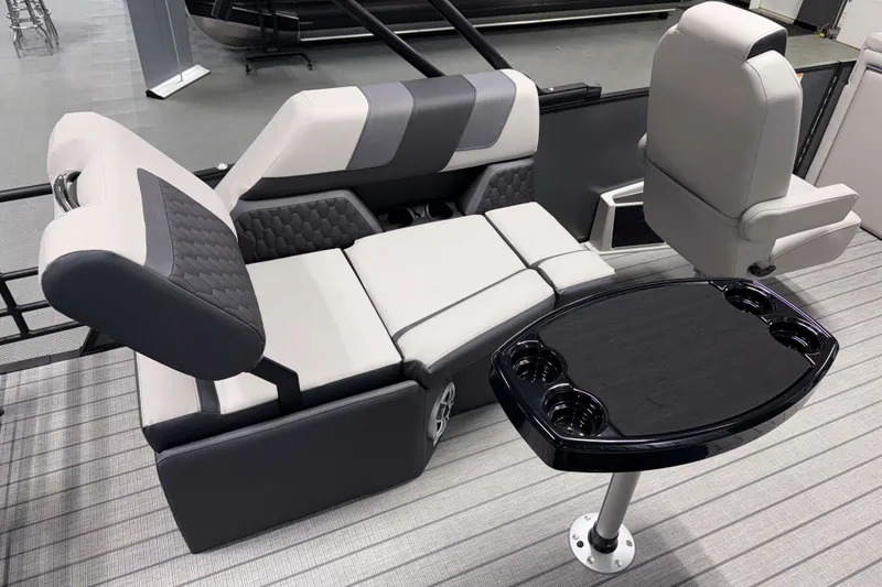 Slide: The Image of Luxurious seating and table setup on 2026 Sylvan L1 LZ boat, featuring modern design and comfort. - 7