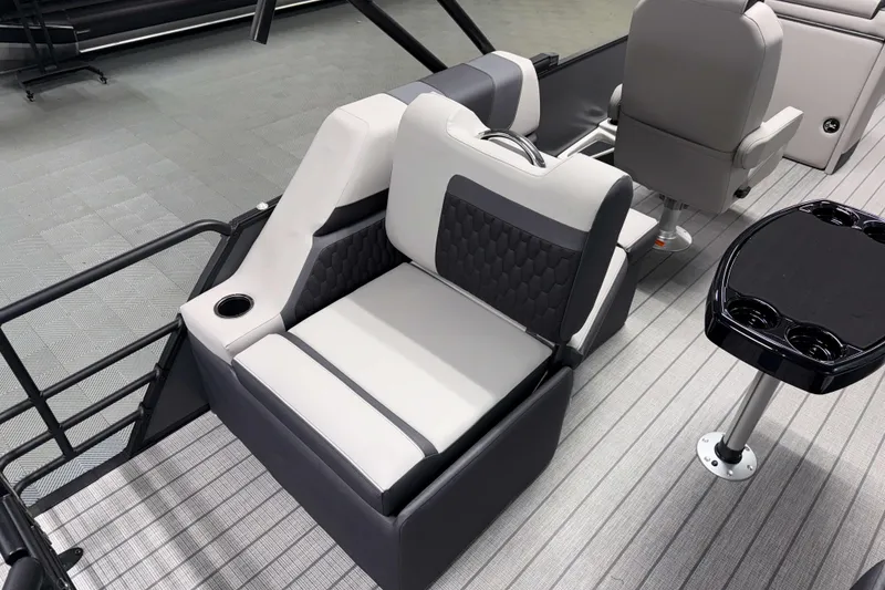 Slide: The Image of 2026 Sylvan L1 LZ boat interior with gray seating and cup holders. - 8